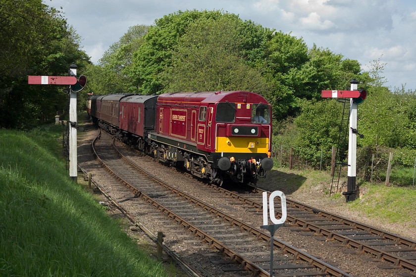 20227, 10.35 Holt-Sheringham, Weybourne station 
 At the far end of Weybourne station on the North Norfolk Railway, 20227 'Sherlock Holmes' arrives with the 10.35 Holt to Sheringham working. 20227 was on loan for the summer season from the Class 20 Locomotive Society. It looks very smart, if a little unorthodox, in its London Transport livery. 
 Keywords: 20227 10.35 Holt-Sheringham Weybourne station