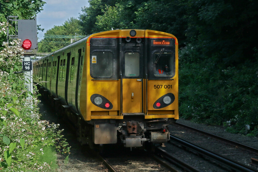 507001, ME 15.27 Southport-Hunts Cross, (2U40, 5L), Liverpool South Parkway station 
 What will almost certainly be my last photograph of a Class 507 unit in operational service. Celebrity unit 507001 leaves Liverpool South Parkway as the 15.27 Southport to Hunts Cross. Andy and I had travelled almost the entire length of the Merseyrail Northern Line network on this train from Southport. It's a shame that the confined lighting does not reveal that this unit is painted in a reproduction of BR's blue and grey livery as it first appeared when it entered service back in 1978. 
 Keywords: 507001 15.27 Southport-Hunts Cross 2U40 Liverpool South Parkway station Merseyrail