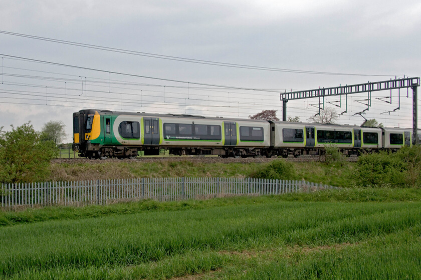 350237, LN 11.14 Birmingham New Street-Milton Keynes Central (2Y62, RT), between Roade & Ashton 
 On a gloomy Bank Holiday Monday 350237 leads another unidentified Desiro between Roade and Ashton covering the final few miles of its journey as the 11.14 Birmingham to Milton Keynes service. Due to the complete closure of the WCML and Euston south of Milton Keynes all trains were terminating at and departing from the Buckinghamshire town. 
 Keywords: 350237 11.14 Birmingham New Street-Milton Keynes Central 2Y62 between Roade & Ashton London Northwestern Desiro