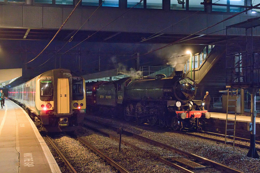 61306, return leg of Steam Dreams Excursion, 17.37 Worcester Shrub Hill-London Euston (1Z62), Northampton station 
 61306 'Mayflower' arrives at Northampton station with the return 17.37 Worcester Shrub Hill to London Euston return Steam Dreams Excursion. Unfortunately, the view is spoilt by 350121 sitting at platform two. This had arrived on the rear of a London train to then be moved to the Kingsheath depot but promptly failed! Initially, 61306 faired better, leaving on-time and followed its booked path until it ran into problems at Watford Junction where it departed 97 minutes late! It then ran to Willesden presumably after the remaining beleaguered passengers had been de-trained. 
 Keywords: 61036 Steam Dreams Excursion 17.37 Worcester Shrub Hill-London Euston 1Z62 Northampton station