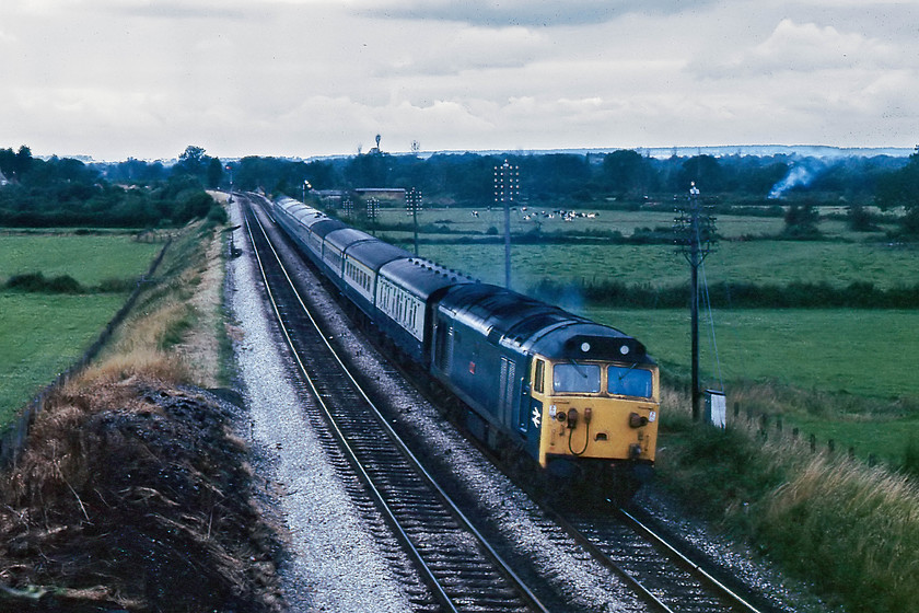 50021, 06.24 Penzance-London Paddington, Castle Cary A371 road bridge 
 Heading the 06.24 Penzance to London Paddington, 50021 'Rodney' prepares for the climb to Brewham Summit, approximately 6 miles of rising gradient, at its steepest 1:79. It is about to pass under the A371/B3153 road bridge just to the west of Castle Cary Station. 
 Keywords: 50021 06.24 Penzance-London Paddington Castle Cary A371 road bridge