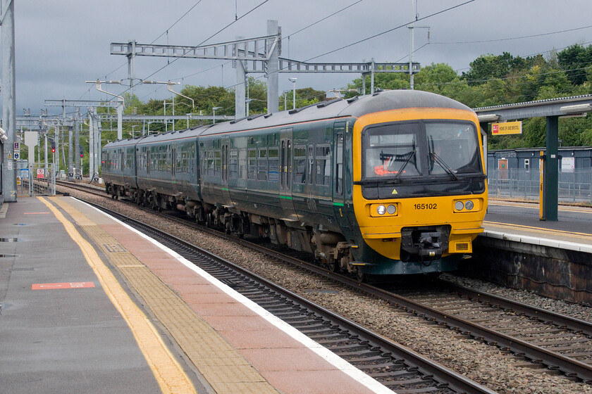 165102, GW 17.10 Gloucester-Weymouth (2O84, 5L), Bristol Parkway station 
 The clouds may be ominous but at least the rain has stopped....for the moment! GWR's 165102 arrives at Bristol Parkway station working the 17.10 Gloucester to Weymouth service. On arrival at Bristol Temple Meads, this service will reverse and head out east towards Bath to then head south at Bathampton Junction and onwards towards the coast via a wandering route through Westbury, Castle Cary, Yeovil and Dorchester. 
 Keywords: 165102 17.10 Gloucester-Weymouth 2O84 Bristol Parkway station GWR Turbo