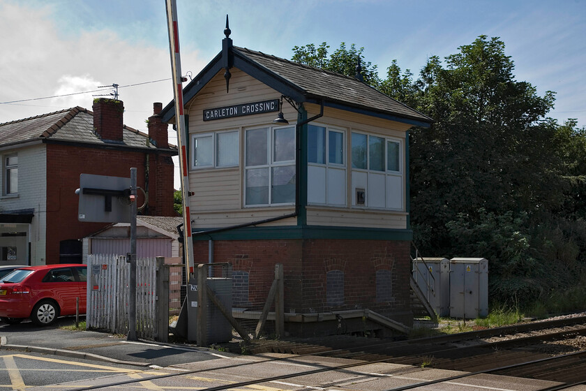 Carleton Crossing signal box (LNW, 1924) 
 The small but perfectly formed LNWR box at Careton Crossing in the suburbs of Blackpool. The Type 5 box was built in 1924 replacing a 1912 built L&Y standard design signal box located diagonally across the level crossing behind where I am standing. When the line into Blackpool is electrified in the next year or two this box will close along wth all the others on the short seventeen-mile section of track from Preston. 
 Keywords: Carleton Crossing signal box LNWR