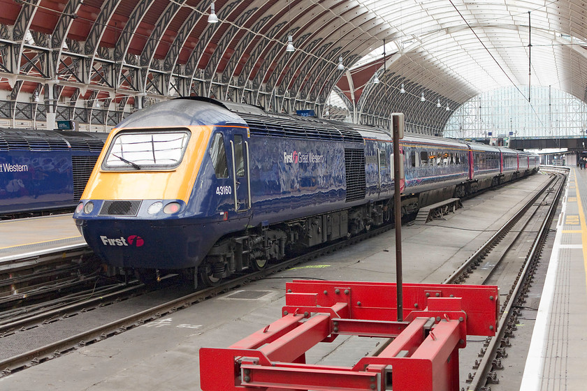 43160, GW 14.27 London Paddington-Chippenham (Because of Bath Spa closure) (1C18, 8L), London Paddington station 
 A classic scene under the beautiful train shed at Paddington station! 43160 'Sir Moir Lockhead OBE' brings up the rear of the 14.27 to Chippenham. This train terminated at the Wiltshire town as Bath Spa was closed for extensive re-modelling over the Easter period. Passengers for Bath would then face the relatively short bus journey from Chippenham. Incidentally, the HST was named after the the former Scottish bus company manger who went on to form and lead First Group. 
 Keywords: 43160 1C18 London Paddington station