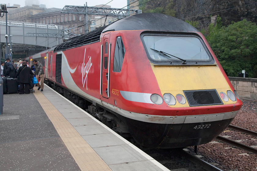 43272, GR 14.00 London King`s Cross-Aberdeen (1S20), Edinburgh Waverley station 
 43272 sits at the rear of the 14.00 King's Cross to Aberdeen as it pauses at Edinburgh Waverley on its 523 mile journey. Notice the family on the platform with their luggage. I have never seen so many bags taken off a train, they were in the guard's compartment of the power car, I hope that they were 'distributed evenly' as they must have been close to the weight limit for it! 
 Keywords: 43272 14.00 London King`s Cross-Aberdeen 1S20 Edinburgh Waverley station