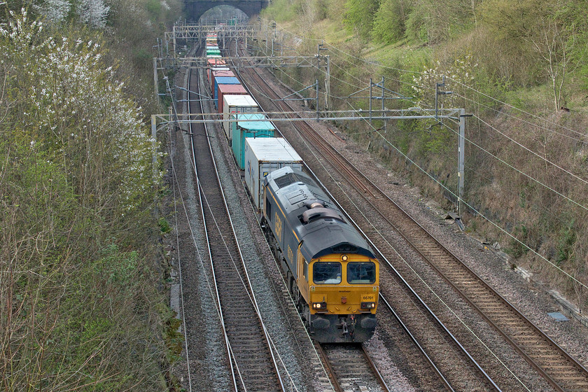 66701, 14.18 Trafford Park-Felixstowe North (4L18, 8L), Roade Hyde Road bridge 
 Just four minutes behind the previous freight (4L92) the 4L18 14.18 Trafford Park to Felixstowe is led by GBRf's 66701. It is on the up fast following the prolonged closure of the up and down slow lines and is seen about to pass under Roade's Hyde Road bridge. 
 Keywords: 66701 14.18 Trafford Park-Felixstowe North 4L18 Roade Hyde Road bridge