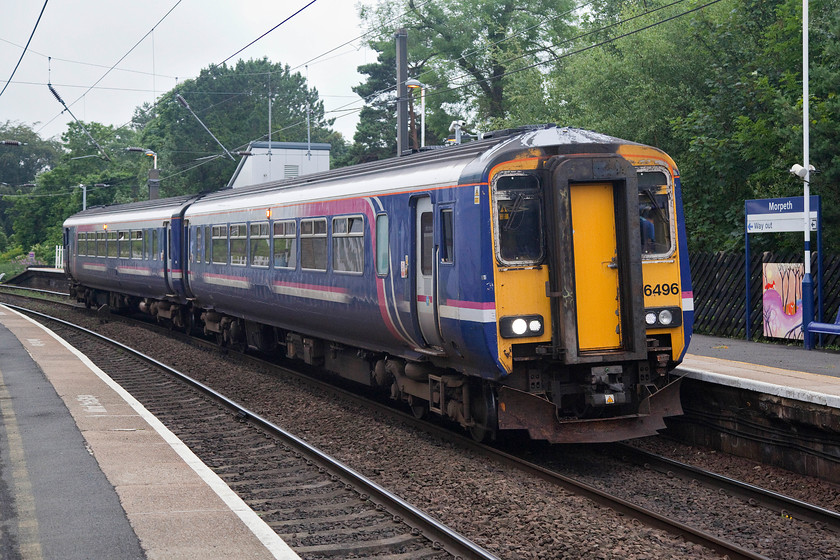 156496, NT 16.23 Carlisle-Chathill (2A40, 2L), Morpeth station 
 156496 arrives at Morpeth station forming the 16.23 Carlisle to Chathill service. We saw this same working at Carlisle exactly a week before formed by another Northern class 156. 156496 has traversed the Tyne and Eden valleys, through Hexham, passed through Newcastle and is now heading up the ECML as far as the remote station at Chathill. After crossing over from the down to the up line just north of its destination it will head south again back towards Newcastle. 
 Keywords: 156496 16.23 Carlisle-Chathill 2A40 Morpeth station