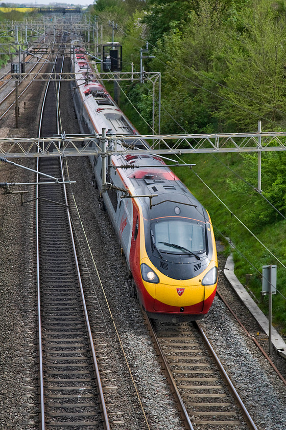 390006, VT 15.37 London Euston-Manchester Piccadilly (1H70), Victoria bridge 
 390006 races north under Victoria bridge just south of Roade working the 1H70 15.37 Euston to Manchester Piccadilly. 
 Keywords: 390006 15.37 London Euston-Manchester Piccadilly 1H70 Victoria bridge