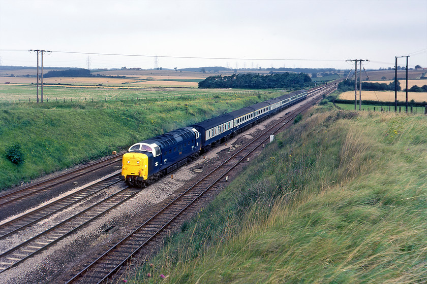 55015, 07.00 Hull-London King's Cross, The Hull Executive (1A04), Essendine TF043129 
 The 07.00 Hull to King's Cross was the named the Hull Executive and ran fast to the capital after its final stop at Newark (added from the start of the summer 1980 timetable). It is seen here passing Essendene at the southern end of Stoke bank with what I have recorded as being 55015 'Tulyar' leading. This would appear to tie in with the records on the Chronicles of Napier website but does throw into doubt some of the other workings recorded the previous eveing? 
 Keywords: 55015 Tulyar 07.00 Hull-London King's Cross The Hull Executive 1A04 Essendine TF043129 Deltic