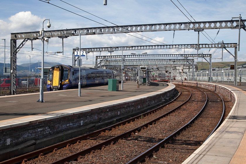 350016, SR 14.38 Gourock-Glasgow Central (2G54, RT), Gourock station 
 350016 waits at Gourock station with the 14.38 to Glasgow Central. Gourock is at the end of the Inverclyde Line as it stops on a pier in the Clyde Estuary. When I visited during my 1984 Scottish Railrover, the station was a much grander affair. Admittedly, it did have an air of decay and was crying out for improvements but I was somewhat shocked at what had been done! 
 Keywords: 350016 2G54 Gourock station