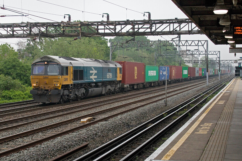 66789, 04.35 Felixstowe North-Birch Coppice (4M08, 13E), South Kenton TfL station 
 The forecast was for a bright and sunny spring day but it dawned very grey and misty as seen here at South Kenton station. This actually worked in my favour because if the sun had been out at this time this view would have been straight into it! 66789 'British Rail 1948-1997' heads northwards leading the 04.35 Felixstowe North to Birch Coppice service. The heritage-painted Class 66 looks a little dirty and unkempt which is in marked contrast to the condition that this example is usually kept in. 
 Keywords: 66789 04.35 Felixstowe North-Birch Coppice 4M08 South Kenton TfL station British Rail 1948 - 1997