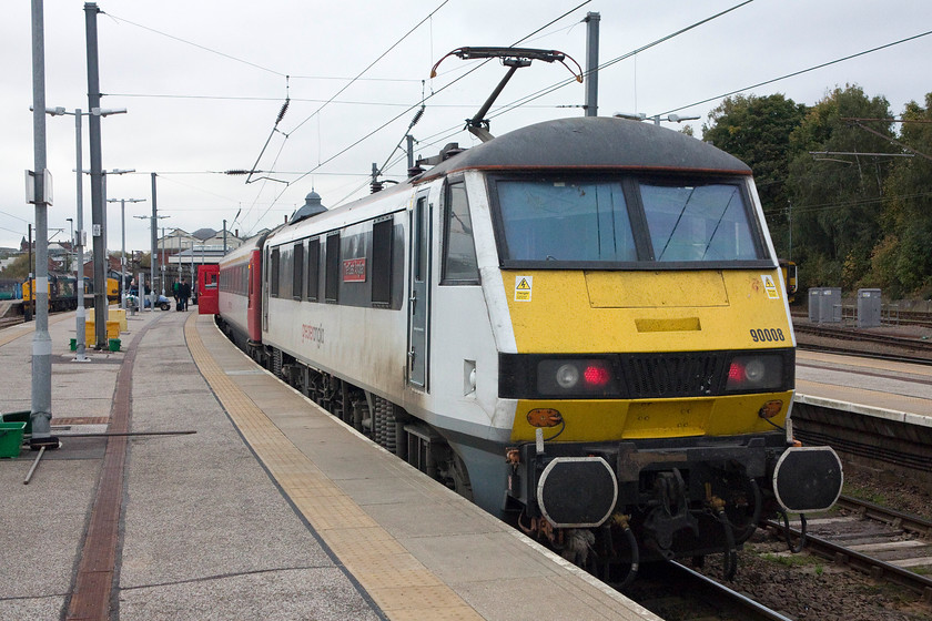 90008, LE 15.00 Norwich-London Liverpool Street (1P47, 2L), Norwich station 
 As the driver has not arrived to his train yet, the tail lights are still showing red even though it's a short time before departure. 90008 'The East Anglian' stands at Norwich waiting to leave with the 15.00 to Liverpool Street. 
 Keywords: 90008 15.00 Norwich-London Liverpool Street 1P47 Norwich station