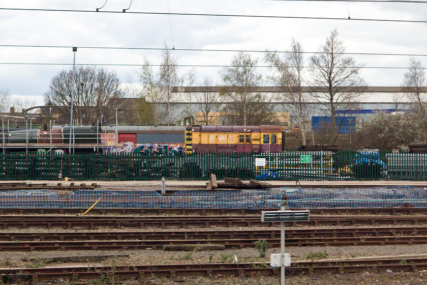 08737, stabled, Crewe Yard 
 08737 is back very close to where it was built in 1960 being stabled just south of Crewe station. This shunter had a career that saw it move many times being in use from Polmadie in Edinburgh to Eastleigh! It looks a bit sorry for itself here at Crewe, but I am not sure what future it now has ahead of itself? 
 Keywords: 08737 Crewe Yard