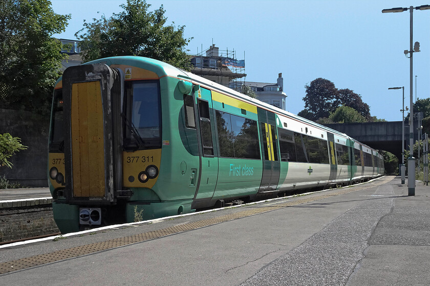 377311, SN 16.06 Brighton-Seaford (2C44, RT), Lewes station 
 The 16.06 Brighton to Seaford shuttle train arrives at Lewes station in some warm afternoon sunshine. I travelled on this train from here to Seaford, a journey of about twenty minutes. I am not quite sure what inspired me to take this photograph resurrecting my boyhood low-angle stance that was so popular with me back in the 1970s, see... https://www.ontheupfast.com/p/21936chg/24049435404/x1111-westbury-station 
 Keywords: 377311 16.06 Brighton-Seaford 2C44 Lewes station Southern Electrostar