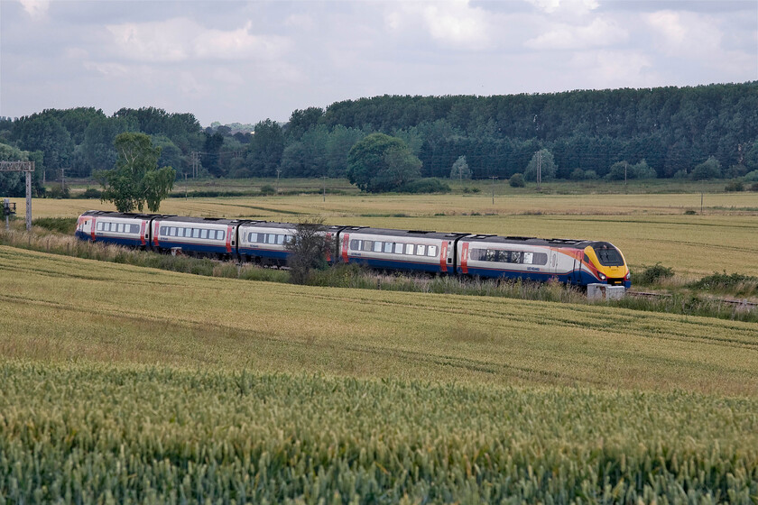 222012, EM 10.49 Sheffield-London St. Pancras (1C37), Harrowden Junction from The Slips 
 222012 works the 10.49 Sheffield to St. Pancras service past Harrowden Junction between Kettering and Wellingborough. The photograph is taken from the intriguingly named road, The Slips. This road was closed at the time this photograph was taken due to the old bridge that carried it over the MML being replaced to accommodate the forthcoming electrification wiring. 
 Keywords: 222012 10.49 Sheffield-London St. Pancras 1C37 Harrowden Junction from The Slips