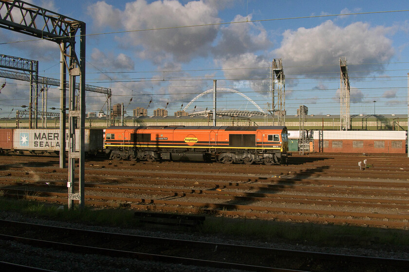 66419, unidnetified up Freightliner, Wembley Yard 
 Another former DRS Class 66, seen in its Genesee & Wyoming livery, sits in Wembley Yard proudly wearing its recently applied 'Lionesses' Roar' nameplates. Interestingly, it sits square in front of Wembley stadium where, of course, the Lionesses enjoyed their 2-1 victory in the Euros against Germany on 31.07.22 in front of a record-breaking eighty-seven thousand crowd. Unfortunately, I could not identify which service 66419 was leading on this particular day and Mike (with access to Freighmaster) had no luck either. 
 Keywords: 66419 up Freightliner Wembley Yard Lionesses' Roar