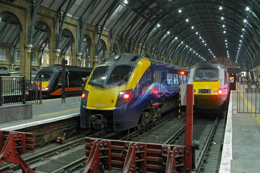 43467, GC 21.47 London King's Cross-Ferme Park ECS (5Y69), 180113, HT 18.30 Hull-London KIng's Cross (1A96) & 43316, GR 22.00 London King's Cross-Leeds (1D34), London King's Cross station 
 Despite it being past 21.00 King's Cross remains busy as witnessed by this view from the concourse inside the fine train shed. From left to right......

43467, 21.47 King's Cross to Ferme Park ECS (5Y69)
180113, 18.30 Hull King's Cross (1A96)
43316, 22.00 King's Cross to Leeds (1D34) 
 Keywords: 43467 21.47 London King's Cross-Ferme Park ECS 5Y69 180113 18.30 Hull-London KIng's Cross 1A96 43316 22.00 London King's Cross-Leeds 1D34 London King's Cross station