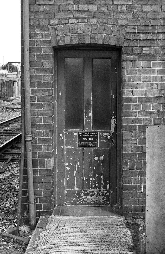 Door, Yeovil Pen Mill signal box (GW, 1937) 
 This door at the end of Yeovil Pen MIll's signal box serves two purposes. One it permits access to the locking room and two for the signalmen to reach the lever room with a set of internal steps that is a little unusual. The British Railways Western Region notice will have replaced a GWR cast sign one suspects. One other observation, the general condition of the door reflects the level of maintenance that BR was able to afford on their infrastructure at this time and was very much a sign of the times. 
 Keywords: Door Yeovil Pen Mill signal box 1937 GWR Great Western Railway