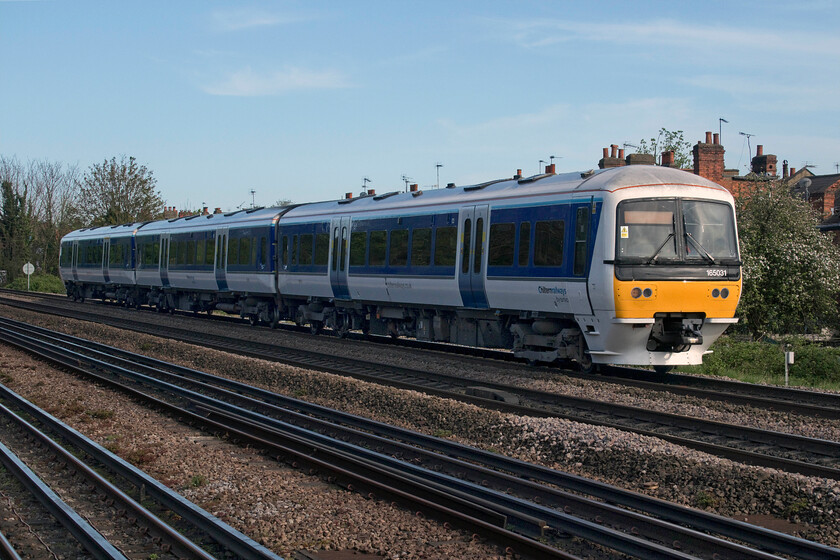 165031, CR 16.42 London Marylebone-Aylesbury Vale Parkway (2V47, RT), Dollis Hill TfL station 
 Taken the wrong side for the afternoon sunshine Chiltern's 165031 passes Dollis Hill's TfL station working the 2V47 16.42 Marylebone to Aylesbury Va;e Parkway local stopper service. This is an unusual spot in north London with three lines running side by side for some distance, with the Jubilee and Metropolitan TfL lines adjacent to the heavyweight Chiltern route 
 Keywords: 165031 16.42 London Marylebone-Aylesbury Vale Parkway 2V47 Dollis Hill TfL station Chiltern Railway