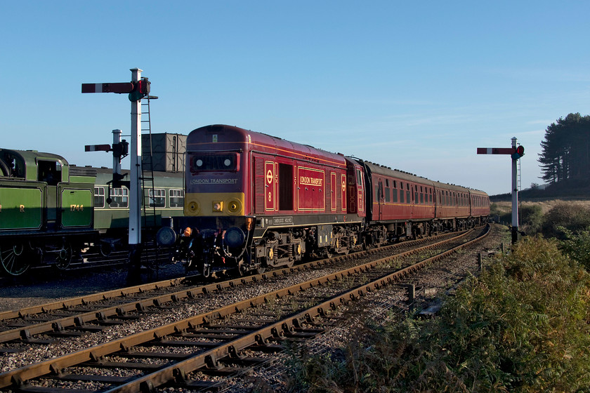 20227, 09.55 Sheringham-Holt, Weybourne station 
 20227 'Sherlock Holmes' arrives in to Weybourne station nose first with the first train on the day on the North Norfolk railway, the 09.55 from Sheringham to Holt. Notice that this train is crossing over on to the wrong platform as daily supplies are sent up to Weybourne (and Holt) from the railway's base at Sheringham on this train and they are more easily unloaded straight into the station from this platform. 
 Keywords: 20227 09.55 Sheringham-Holt Weybourne station