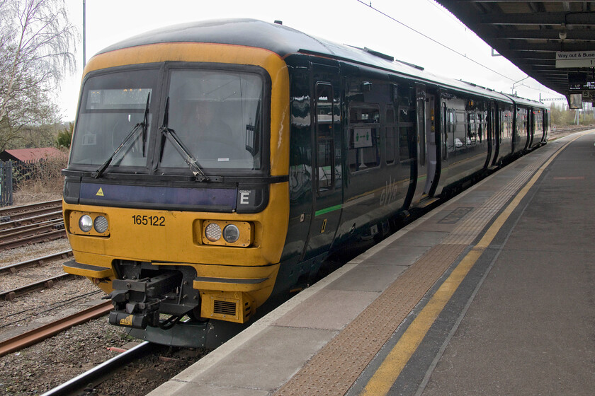 165122, GW 16.35 Didcot Parkway-Oxford (16.35 Didcot Parkway-Oxford) (2L50, 1L), Didcot Parkway station 
 As the electrification, that had been started, from Didcot to Oxford has been cancelled GWR now have to operate a somewhat farcical and highly unsatisfactory shuttle service between the two places. GWR utilise a number of cascaded Class 165s to operate these trains with some being all-station stoppers and some going through to Banbury. The third leg of our journey from Frome to Northampton involved making this short jump aboard the 16.35 Didcot to Oxford train worked by 166122 seen here waiting to leave its starting point. 
 Keywords: 165122 16.35 Didcot Parkway-Oxford 2L50 Didcot Parkway station Great Western Railway