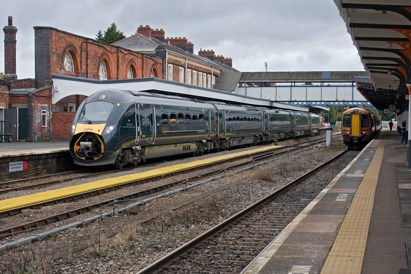 800028, GW 13.16 Worcester Shrub Hill-London Paddington (1P30, 20L) & 172221, LN 12.03 Dorridge-Worcester Foregate Street (2V52, RT), Worcester Shrub Hill station 
 Fellow photographer Martin Loader (of Honda Wanderer fame) recently commented on the number of GWR IETs running around with their nose dorrs open, see... http://www.hondawanderer.com/800318_Little_Bedwyn_2024.htm Today all but one of those Andy and I observed also had their doors open doing nothing for aerodynamics and the protection of the mechanism inside. 800028 'Sir Peter Parker' and 'Oliver Lovell' will soon depart Worcester Shrub Hill for London with the 13.16 to Paddington, again, with its nose exposed. Meanwhile, 172221 has just arrived with the 12.03 from Dorridge. Within a few minutes, it will leave in the opposite direction but head off to the west to terminate at Foregate Street. 
 Keywords: 800028 13.16 Worcester Shrub Hill-London Paddington 1P30 172221 12.03 Dorridge-Worcester Foregate Street 2V52 Worcester Shrub Hill station GWR IET West Midlands Trains