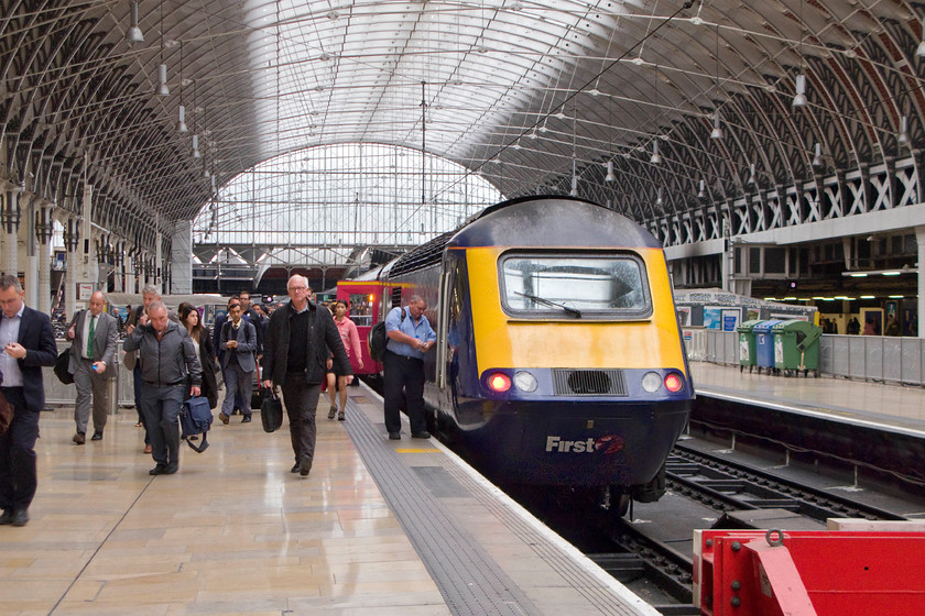 43148, GW 06.42 Hereford-London Paddington (1P26), London Paddington station 
 As the passengers make their way towards the concourse at Paddington station the driver locks the cab of 43148. The HST service has just arrived as the 1P26 06.42 from Hereford. This particular power car has been on the Western Region since its entry into service in May 1981 as services to the west of England were introduced. At the time I probably cursed them passing me on the lineside as they were ousting the Class 50s but over forty years on thigs are now a little different as the HSTs themselves come to the end of their working lives. 
 Keywords: 43148 06.42 Hereford-London Paddington 1P26 London Paddington station FGW First Great Western