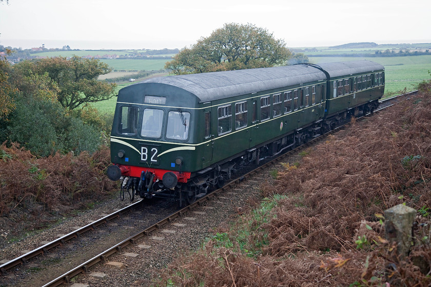 M51192 & M56352, 09.55 Sheringham-Holt, Kelling Bank 
 A dull morning in north Norfolk means that the sea can hardly be made out from this superb spot. One of the Poppy Line's class 101 DMUs formed of M51192 and M56352 climbs Kelling Bank with the first train of the day, the 09.55 Sheringham to Holt. I love this spot, it's a great place to wait for trains listening to the birds and to the wind in the gorse! 
 Keywords: M51192 M56352 09.55 Sheringham-Holt Kelling Bank