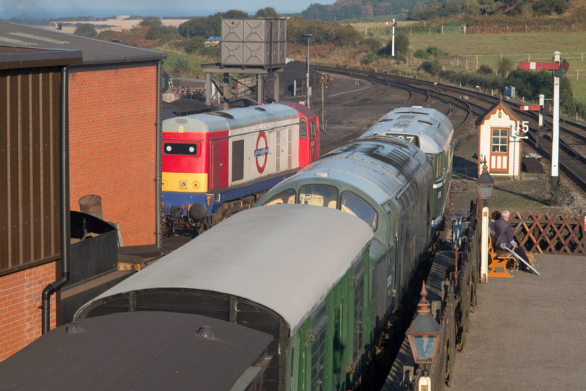 20227, D5631 & D6732, stabled, Weybourne station 
 Taken from the footbridge of Weybourne station, the yard and some of their stock can be seen basking in the warm autumnal sunshine. As well as D6372 (37032) and D5631 (31207) 20227 is also clearly on view in its London Underground livery. The twenty is owned by the Class 20 Locomotive Society but it seems to have taken up residence at the NNR. 
 Keywords: 20227 D5631 D6732 Weybourne station