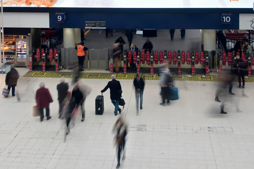 Concourse, London Waterloo station 
 A lone figure waits for his train to be called on the concourse at Waterloo station whilst all around him people are on the move!