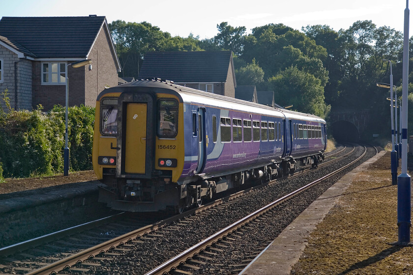 156452, NT 15.29 Buxton-Barrow-in-Furness, Dalton station 
 Taken very much against the evening light the 15.29 Buxton to Barrow Northern service leaves Dalton station. Close to the end of this rather complexly routed service that saw it pass through Manchester from east to west, 156452 will soon pass through the relatively short Dalton tunnel. 
 Keywords: 156452 Northern 15.29 Buxton-Barrow-in-Furness Dalton station