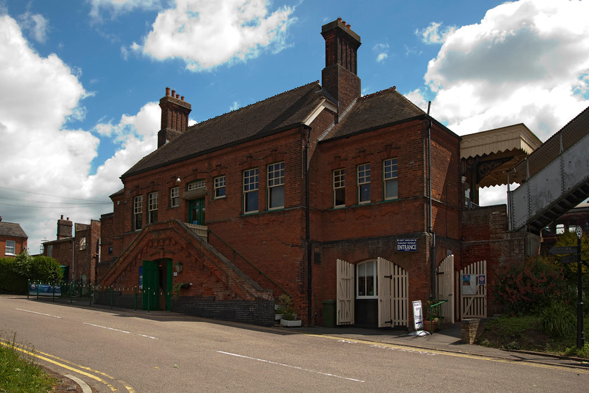 Frontage, Chappel & Wakes Colne station 
 If there was a prize for a station name, Chappel and Wakes Colne would be a contender to win it! The building is an impressive and substantial brick built structure that is far bigger than would be expected for such a rural location. Whilst Greater Anglia services use one of the platforms, access is not through the building as shown here with passengers having to to walk up to the left and round the building on to the platform. The building and other infrastructure is home to the East Anglian Railway Museum. 
 Keywords: Chappel & Wakes Colne station