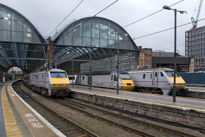 180109, HT 10.42 King's Cross-Hull (1H02), 91104, GR 08.56 King's Cross-Leeds (1D07), 43308, GR 08.45 King's Cross-Dundee (1S09) & 91103, GR 09.56 King's Cross-Leeds (1D09), London King's Cross station 
 Despite it being relatively early on a Sunday morning a busy scene is in on view at King's Cross station. Deep in the train shed is Hull Trains' 180109 that will work the 10.42 departure to Hull. Next in line is 91104 that will leave in just over an hour leading the 1D07 08.56 to Leeds. An HST set led by 43308 is next that will leave first out of all the trains seen as the 1S09 08.45 to Dundee. Finally, 91103 will lead the 09.56 to Leeds. 
 Keywords: 180109, HT 10.42 King's Cross-Hull (1H02), 91104, GR 08.56 King's Cross-Leeds (1D07), 43308 08.45 King's Cross-Dundee 1S09 91103, GR 09.56 King's Cross-Leeds 1D09 London King's Cross station East Coast HST Hull Trains