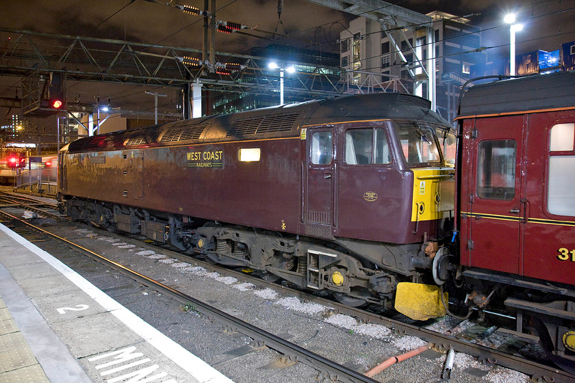 47854, 22.18 London KIng's Cross-Ferme Park ECS (5Z49), London King's Cross station 
 At the country end of King's Cross station, 47854 'Diamond Jubilee' idles waiting to lead the 22.18 empty coaching stock train to Ferme Park. There the WCR Class 47 will run round and lead the train across North London to Wembley and later Acton for access to WCR's Southall facility. Unfortunately, something went wrong later in the night with the train remaining at Ferme Park until morning moving later the next day. 
 Keywords: 47854 22.18 London KIng's Cross-Ferme Park ECS 5Z49 London King's Cross station Diamond Jubilee Railway Touring Company WCR West Coast Railways