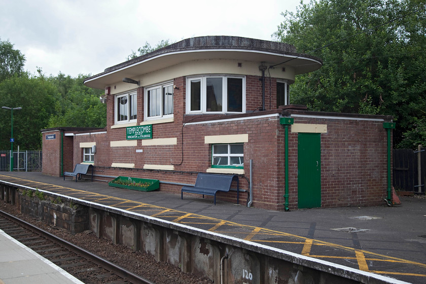 Templecombe signal box (SR, 1938) 
 Taken from the new platform at Templecombe is the fantastic art deco style former signal box that closed when resignalling took place in 2012. It is a classic 'glasshouse' SR Type 13 box that was opened in 1938 and the most westerly of this type and the only one of its type on this line. Currently, it is used by the 'friends' of the station who can access it via the gated and locked footbridge. Templecombe station used to be a very busy station at the interchange of the Somerset and Dorset and the Southern's routes with extensive yards and a large shed. 
 Keywords: Templecombe signal box