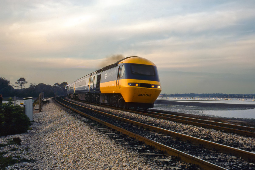 43031 (253015), 16.25 London Paddington-Penzance, Cockwood Harbour 
 Unfortunately, with the failing light and using Kodachrome film meant that I was pushing things a little to capture an HST at speed with no motion blur. 43031 leads the 16.25 Paddington to Penzance service past Cockwood Harbour with the Exe Estuary in the background. Set 253015 entered service in October 1976 initially working between Paddington and Bristol and South Wales. At the time of writing in 2020 it remains in service but in Scotland as part of their super-seven programme. 
 Keywords: 43031 253015 16.25 London Paddington-Penzance Cockwood Harbour HST