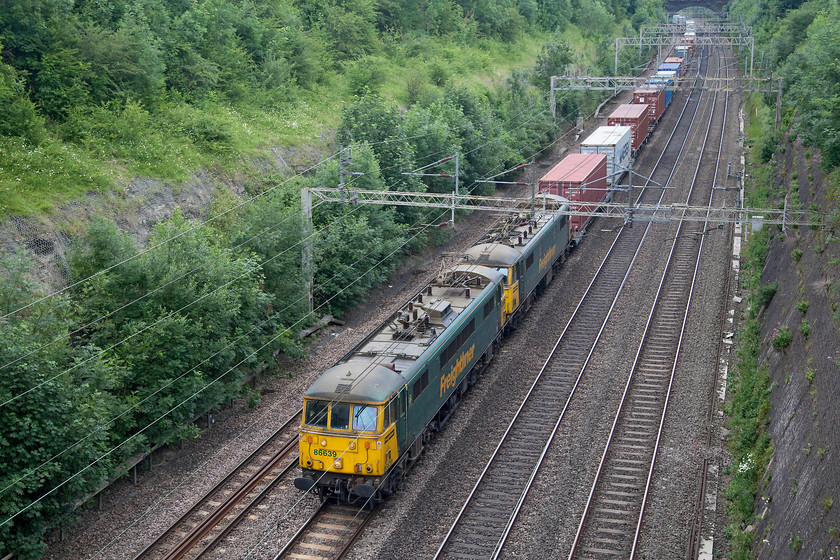 86639 & 86608, 11.13 Felixstowe-Trafford Park (4M87), Roade Cutting 
 Vintage motive power for the 11.13 Felixstowe to Trafford Park Freightliner. 86639 and 86608 pass through Roade Cutting hauling their working north. Freightliner have announced that they are going to continue to use these elderly locomotives for the foreseeable future, testament to their reliability and power. 
 Keywords: 86639 86608 11.13 Felixstowe-Trafford Park 4M87 Roade Cutting