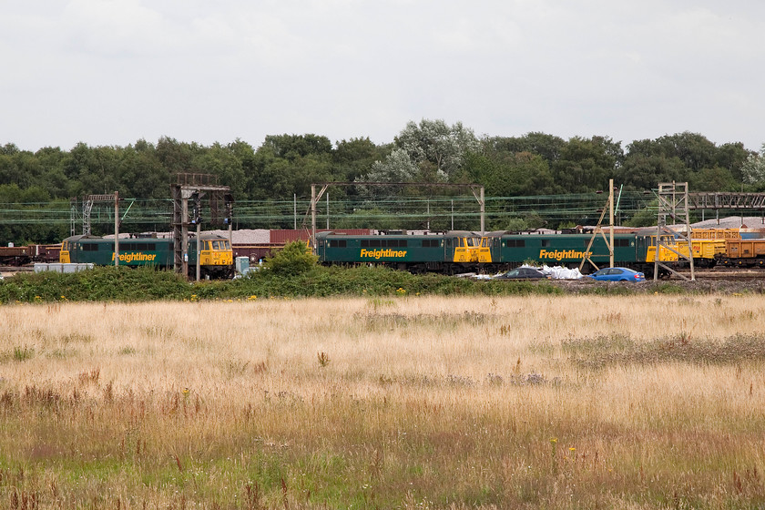 86607, 86613 & 86639, stabled, Crewe Basford Hall 
 After visiting DRS Gresty Bridge's open day I rode my bike up to Basford Hall and, along with lots of other enthusiasts who made the journey on foot, had a look to see what was visible in the huge yard. Three Freightliner class 86s are seen waiting for their next duties, from left to right, 86607, 86613 and 86639 
 Keywords: 86607 86613 86639 Crewe Basford Hall