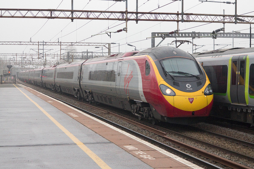 390154, VT 08.05 Manchester Piccadilly-London Euston (1A02), Northampton station 
 A diverted 390154 'Matthew Flinders' passes slowly through Northampton with the Virgin 08.05 Manchester Piccadilly to London Euston. The pendolino was named by HRH The Duke of Cambridge at Euston in July 2014. Matthew Flinders was an English explorer who circumnavigated Australia and so declaring it a continent. 
 Keywords: 390154 08.05 Manchester Piccadilly-London Euston 1A02 Northampton station