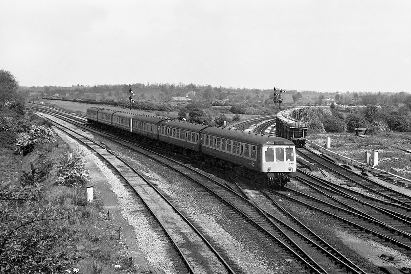 B581 & B579 DMU, unidentified Bristol Temple Meads-Weymouth working, Westbury North 
 Taken from the road bridge just east of Westbury station a two-set six-car DMU approaches the station with an unidentified Bristol to Weymouth working. The leading set is B581, a cross country Gloucester R C & W Co. class 119. Behind it is another class 119 set B579, both of which were common sights in and around this area throughout this era, largely ignored so I am grateful that I took pictures of them! 
 Keywords: B581 class 119 DMU Bristol Temple Meads-Weymouth working Westbury North