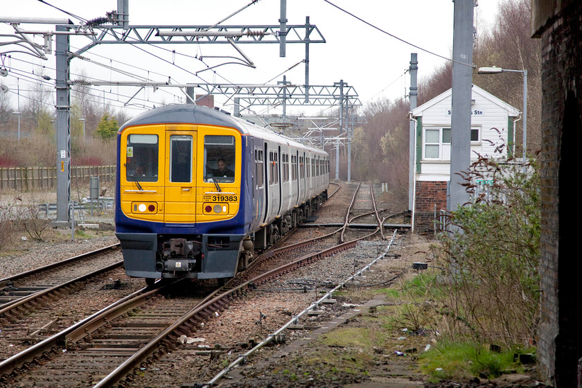 319383, NT 10.03 Wigan North Western-Liverpool LS (2C15, 3L), St 
 319383 arrives into St. Helens Central past the Station signal box with the 2C15 10.03 Wigan North Western to Liverpool Lime Street working. I travelled on this train back to Liverpool. 
 Keywords: 319383 2C15, 3L St. Helens Central Station