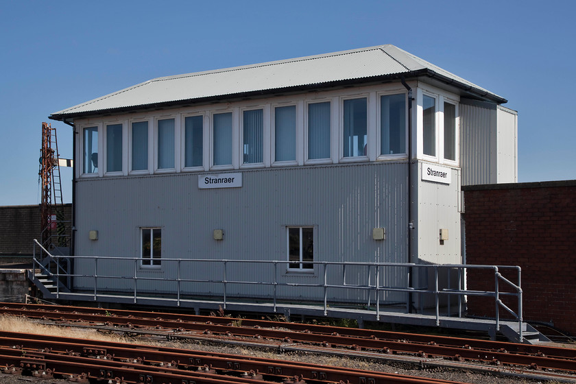 Stranraer (Harbour) signal box (GSW, 1897) 
 Situated on the harbour wall Stranraer signal box is switched out for most of the time. It is in good condition having been weather proofed to protect it from the elements. I photographed the box during my 1984 Railrover but it was seeing a lot more use then operating the various sidings and also because both of Stranraer's platforms were in use then. The box was constructed by the GSW and opened in 1897. 
 Keywords: Stranraer Harbour signal box