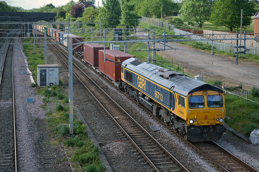 66713, 14.18 Trafford Park-Felixstowe North (4L18, RT), site of Roade station 
 Freight number 2 (17.44) -

GBRf's 66713 'Forest City' leads the 14.18 Trafford Park to Felixstowe that again arrived on time at its destination. 66713 was named when it entered service in April 2003 after the birthplace of Class 66 in London, Ontario - ironically a plant that has now been shut down! 
 Keywords: 66713 14.18 Trafford Park-Felixstowe North 4L18 site of Roade station Forest City GBRf GB Railfreight