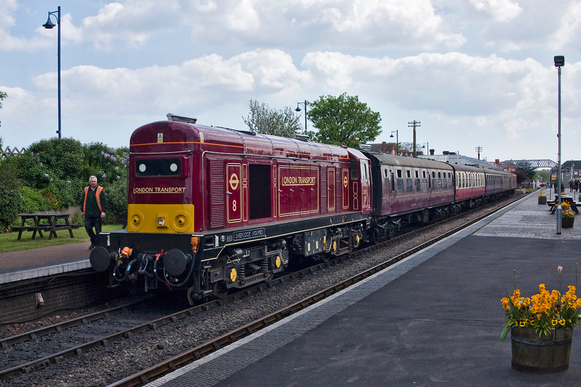 20 227 11.20 Sheringham-Holt Sheringham station 
 20227 'Sherlock Holmes' has run-round the stock and about to leave Sheringham nose first with the 11.20 to Holt. The sight of a class 20, in this sightly odd livery on the north Norfolk coast is a little incongruous but at least it's different to their usual heritage diesels. 
 Keywords: 20 227 11.20 Sheringham-Holt Sheringham station