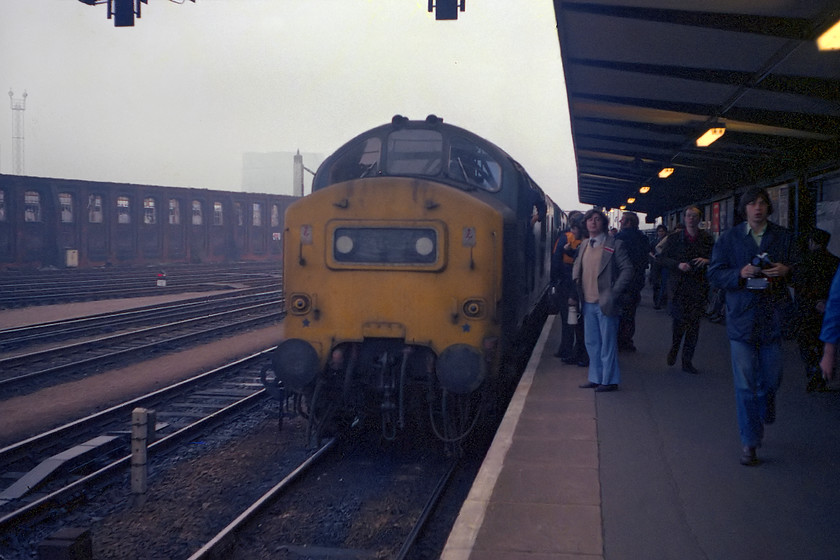 37204 & 37282, outward leg of The Pennine Explorer, Cardiff Central-Rotherwood, Gloucester station 
 In the early morning autumnal gloom at Gloucester station, 37204 and 37282 have arrived with the The pennine Explorer railtour. The headboard has already been removed in preparation for the 37s being detached and running round to continue the journey north. We had only joined the railtour relatively recently picking it up at Bristol Parkway after travelling from Bradford-on-Avon via Bristol Temple Meads. This journey included an early morning charge up Filton Bank behind 50008 'Thunderer'! 
 Keywords: 37204 37282 The Pennine Explorer Cardiff Central-Rotherwood Gloucester station