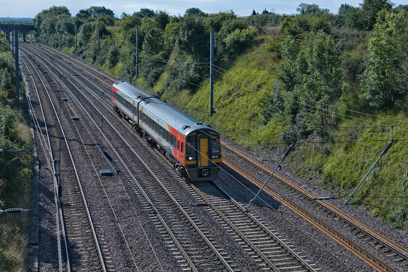 158856, EM 07.57 Norwich-Liverpool Lime Street (1R70), Essendine TF04212 
 158856 takes the down fast line past Essendine working the 07.57 Norwich to Liverpool Lime Street service. These services only travel on the ECML for a short time making a relatively quick dash, to stay out of the way of mainline services to and from London, between Peterborough and Grantham. 
 Keywords: 158856 07.57 Norwich-Liverpool Lime Street 1R70 Essendine TF04212 East Midlands