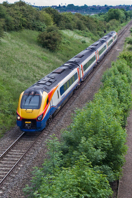 222019, EM 13.01 London St. Pancras-Corby (1N01), Glendon Road bridge SP855815 
 222019 works the 13.01 St. Pancras to Corby 1N01 service away from Kettering on the final leg of its journey. The single line to and from Corby is now busy with regular passenger services intertwined with freight creating some problems for the signallers. It will be doubled in the next few years and electrified. Notice the floodlights on the skyline on the former Kettering Town's Rockingham Road ground that they vacated three years ago following them entering administration. 
 Keywords: 222019 13.01 London St. Pancras-Corby 1N01 Glendon Road bridge SP855815 East Midlands Meridian