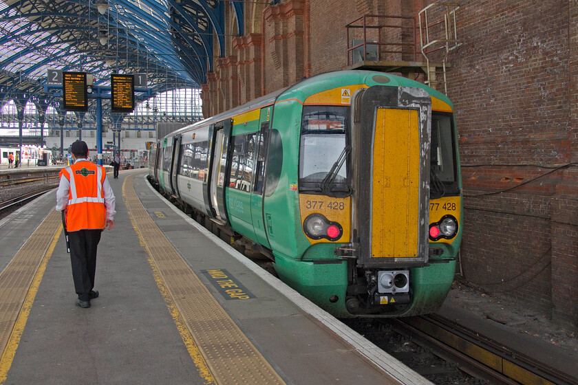 377428, SN 16.00 Brighton Portsmouth Harbour (cancelled from Chichester) (1S28, 12L), Brighton station 
 I had intended to travel aboard 377428 all the way to Barnham in order to change there for Littlehampton. Unfortunately, a signalling failure forced a change of plans with the 16.00 Brighton to Portsmouth Harbour service held for some time at its first stop, Hove. Indeed, such was its delay that the 1S28 Southern service was cancelled completely at Chichester. Prior to a slightly late departure from Brighton, the dispatcher waits for the driver to arrive, set his train up and depart from platform one. 
 Keywords: 377428 16.00 Brighton Portsmouth Harbour cancelled from Chichester 1S28 Brighton station Southern Electrostar