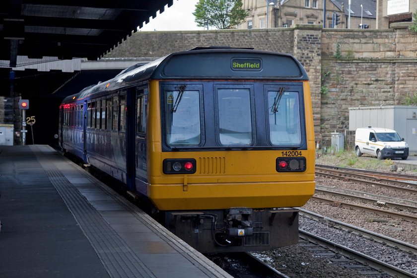 142004, NT 10.13 Huddersfield-Sheffield (2B39, 4L), Huddersfield station 
 142004 waits for the road at Huddersfield station. It's about to work the 10.13 to Sheffield that will run via Penistone and Barnsley, the majority of the journey on single-line track. 
 Keywords: 142004 2B39 Huddersfield station