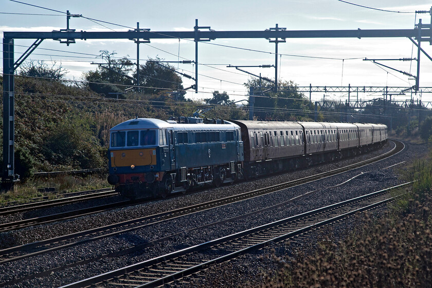 86259, outward leg of The Cumbrian Coast Express, 07.08 London Euston-Carlisle (1Z86, 2L), Heamies bridge 
 Rather backlit but as I had limited knowledge of the area I had to make do with this spot at the very northern edge of the recently remodelled Norton Bridge Junction. In fact, the completely new down slow line is seen to the immediate right lunging down from the dizzy heights of where the line passes under Searchwood Lane having bypassed Norton Bridge completely. Old favourite 86259 'Les Ros/Peter Pan' is seen leading the outward leg of The Cumbrian Coast Express running under its usual guise of 1Z86. Passengers enjoyed a run along the WCML as far as Carlise where Stanier Black 5 44932 would take over for a spectacular run south along the Cumbrian Coast to Carnforth. 
 Keywords: 86259 The Cumbrian Coast Express 07.08 London Euston-Carlisle 1Z86 Heamies bridge Les Ross Peter Pan AL6